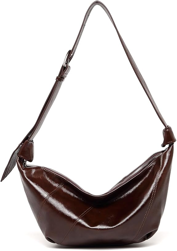 This is a stylish and minimalist black messenger bag for women, equipped with an adjustable shoulder strap, suitable for daily casual use.